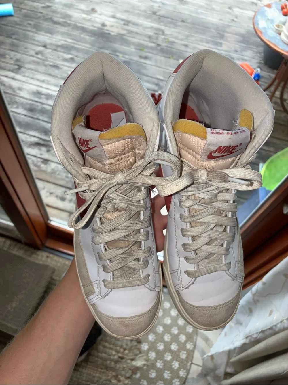 Nike Women's White High-Top Sneakers with Red Swoosh